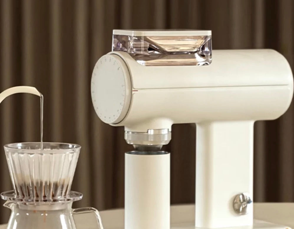 Matte whiteTimemore Sculptor 078S Grinder next to a pour over and decanter